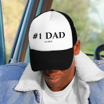#1 Dad Est. 2025 Trucker Hat | New Dad Gift<br><div class="desc">Celebrate the amazing new journey of fatherhood with this bold and simple “#1 DAD – est. 2025” trucker hat. The clean black text on a white front panel gives a modern minimalist vibe that any dad can proudly wear year-round. 🖤 Perfect For: • First-time dads • Father’s Day surprises •...</div>
