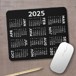 2025 Calendar - modern black and white simple Mouse Mat<br><div class="desc">Black and White - A minimal, basic 12 month 2025 calendar with a solid colour background. A modern look for your home office or school locker. The fonts are simple to read, and the colours can be changed. -------- If you open the customise area, it will take to you to...</div>