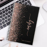 2025 Personalised Black Rose Gold Glitter Planner<br><div class="desc">Personalise this elegant modern design with your name in vertical rose pink signature handwriting script on a black background trimmed with a rose gold faux glitter border. Add the year in sans serif font. (To keep the swashes at the beginning and end of the name, replace only the letters, leaving...</div>