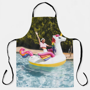 2 children riding on white and red inflatable boat apron
