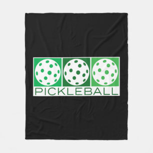 3 Green Pickleballs on white Fleece Blanket