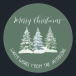 3 Pine Trees Rustic Sage Green Merry Christmas Classic Round Sticker<br><div class="desc">These sage green coloured holiday stickers are perfect as envelope seals or gift tags. They feature a rustic watercolor design with three snow covered pine, fir, or spruce trees and elegant script calligraphy lettering reading: Merry Christmas! There is space for a short note or message below. Optimised for round shaped...</div>