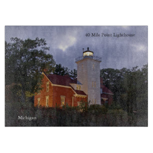 40 Mile Point Lighthouse at dusk cutting board