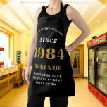 40th Birthday 1984 Name Chic Elegant Black Gold Apron<br><div class="desc">Elegant Black & Gold Chic Apron - 40th Birthday 1984 Name Personalised Kitchen & BBQ Essentials. Celebrate a fabulous birthday with style and practicality! This Elegant Black & Gold Chic Apron, personalised for those born in 1984, is the perfect accessory for the culinary enthusiast in your life. Its eye-catching design,...</div>