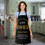 40th Birthday 1985 Name Chic Elegant Black Gold Apron<br><div class="desc">Elegant Black & Gold Chic Apron - 40th Birthday 1985 Name Personalised Kitchen & BBQ Essentials. Celebrate a fabulous birthday with style and practicality! This Elegant Black & Gold Chic Apron is the perfect accessory for the culinary enthusiast in your life. Its eye-catching design, enhanced with a touch of gold,...</div>