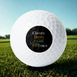 40th Birthday Golf Cheers and Beers Black and Gold Golf Balls<br><div class="desc">This is a cool and modern, 40th birthday, golf design. It is a simple, minimal design, in classic black and gold typography with pops of orange and green. Perfect for a cool and fun, golf and beer themed, 40th birthday gift or party accessory and ideal as birthday keepsakes or party...</div>
