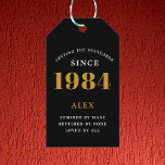 40th Birthday Name 1984 Black Gold Elegant Chic Gift Tags<br><div class="desc">Elegant Chic 1984 Black Gold Personalised 40th Birthday Gift Tags. Celebrate the milestone birthday with our Elegant Chic 1984 Black Gold Personalised 40th Birthday Gift Tags. Each gift tag is meticulously designed with a black and gold colour scheme that oozes elegance. Fully personalised to add that exclusive touch, these gift...</div>