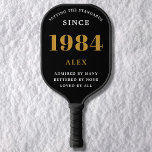 40th Birthday Name 1984 Black Gold Elegant Chic Pickleball Paddle<br><div class="desc">Chic '1984' 40th Birthday Black and Gold Personalised Pickleball Paddle - Elegant Design for Sports Enthusiasts. Celebrate a significant milestone in style with our chic '1984' 40th birthday black and gold pickleball paddle. Elegantly designed and fully personalised, this paddle blends birthday charm and utility in one. Ideal for anyone with...</div>