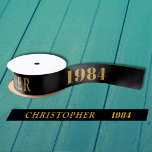 40th Birthday Name 1984 Black Gold Elegant Chic Satin Ribbon<br><div class="desc">40th Birthday Black Gold Elegant Chic Satin Ribbon Born 1984 - Personalised Celebration Accessory. Be a showstopper at your birthday bash with our 40th Birthday Name 1984 Black Gold Elegant Chic Satin Ribbon! Embellished with stunning black and gold, this satin ribbon speaks volumes of your unique style and sophisticated taste....</div>