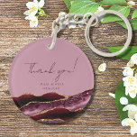 50 and Fabulous Burgundy Pink Thank You Key Ring<br><div class="desc">Looking for a perfect party favour or giveaway for your loved one's birthday celebration? Look no further than this elegant "Thank You" round acrylic keychain! The burgundy red agate slice border with shimmering gold glitter accents against a pink old rose background is sure to catch your guests' eyes and leave...</div>