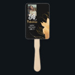 50 and Fabulous Gold Foliage 50th Birthday Photo Hand Fan<br><div class="desc">Celebrate a monumental 50th birthday in style with this elegant '50 & Fabulous' personalized hand fan. Featuring a stunning black background adorned with luxurious gold floral outlines, this design is perfect for marking such a special milestone. Customize it with the birthday person's photo and name for a truly unique touch....</div>