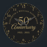 50th Anniversary Black And Gold Dust Confetti  Large Clock<br><div class="desc">Featuring delicate gold dust confetti on a black background. Personalise with your special fifty years golden anniversary information in chic gold lettering. Designed by Thisisnotme©</div>