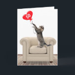50th Birthday Cat With Heart Balloon Card<br><div class="desc">Tabby cat standing on a leather chair playing with a red heart balloon for 50th birthday.</div>