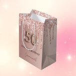 50th birthday rose gold glitter pink balloon style medium gift bag<br><div class="desc">Elegant, classic, glamourous and girly for a 50th birthday party. Rose gold and blush pink, gradient background. Decorated with rose gold, pink faux glitter drips, paint dripping look. Personalise and add a name. With the text: Happy Birthday. The name is written with a modern dark rose coloured hand lettered style...</div>