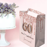 60th birthday rose gold blush glitter drips medium gift bag<br><div class="desc">Elegant, classic, glamourous and girly for a 60th birthday party. A blush pink background. Decorated with rose gold, pink faux glitter drips, paint dripping look. Personalise and add a name. With the text: Happy Birthday. The name is written with a modern dark rose coloured hand lettered style script. Number 60...</div>