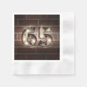 65th birthday marquee sign on brick wall napkin