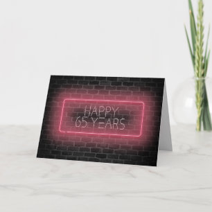 65th birthday neon sign on brick card