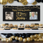 70th Birthday Black Gold String Lights Photos Banner<br><div class="desc">Celebrate a 70th birthday with this black and gold party banner sign with string lights featuring a retro typography title design of 70 YEARS IN THE MAKING that incorporates their birth year as part of the design, 2 photos (fun to include Then and Now photos) and your personalised custom message...</div>