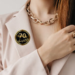 70th birthday gold music notes on stylish black 6 cm round badge<br><div class="desc">Black background with faux gold music notes for a 70th birthday party. With a faux gold frame. Templates for age and name.  The name is written in a hand-lettered style script.  Golden letters and number.</div>