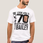 70th birthday mono look 70 custom photo and name T-Shirt<br><div class="desc">70th birthday mono, look who is 70 custom photo and name t-shirt. Fun 70th personalised photo black and white birthday tee design. Personalise this birthday shirt with a photograph of the birthday boy or girl in the middle of the number 0. Great idea for adding some fun to a milestone...</div>
