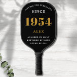 70th Birthday Name 1954 Black Gold Elegant Chic Pickleball Paddle<br><div class="desc">Chic '1954' 70th Birthday Black and Gold Personalised Pickleball Paddle - Elegant Design for Sports Enthusiasts. Celebrate a significant milestone in style with our chic '1954' 70th birthday black and gold pickleball paddle. Elegantly designed and fully personalised, this paddle blends birthday charm and utility in one. Ideal for anyone with...</div>