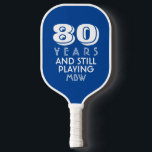 80 Years Still Playing Custom Age Name Text Colour Pickleball Paddle<br><div class="desc">The perfect pickleball paddle for someone who is still out there playing - makes a great birthday, retirement, or anniversary gift. Design features bold typography that reads "80 and still playing" Change the age to 50, 60, 70, etc. and the text to still swinging, still pickling, etc. Also add the...</div>