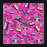 80s retro square wall clock<br><div class="desc">A colorful and retro 80's clock,  it is like stepping into a time machine and travelling to this cool era.  This clock features a lively pink design full of cassette tapes,  colorful instruments,  games and accessories from the 80's.  Purchase yours today!</div>