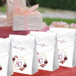 80th Birthday burgundy gold geometric floral white Favour Box<br><div class="desc">Elegant and glamourous for a 80th birthday party. On front flap: burgundy letters and the text: Thank You. Front and back: A chic white background with a faux gold geometric frame. Decorated with dark purple and burgundy flowers, roses and boho style feathers. The name is written with pink hand lettered...</div>