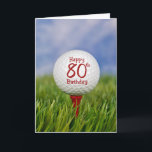 80th Birthday Golf Ball Card<br><div class="desc">Close up of a white golf ball on a red tee in grass with sky background for 80th birthday.</div>