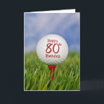 80th Birthday Golf Ball Card<br><div class="desc">Close up of a white golf ball on a red tee in grass with sky background for 80th birthday.</div>