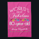 80th Birthday Most Fabulous Colourful Gems Pink Tea Towel<br><div class="desc">Celebrate the milestone birthday of your favourite senior citizen with this fun gift reminding them of how fabulous they are. White and grey lettering on deep pink background. Colourful diamond-cut gems in rainbow tones serve as accent. Customise with names, initials or other text. This series is in increments of 5...</div>