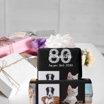 80th birthday party photo collage woman black wrapping paper<br><div class="desc">For a 80th birthday party for a woman,  celebrating her life with a collage of 10 of your own photos.  Photo of family,  friends,  pets,  vacations,  children,  grandchildren. Templates for a name and the age 80 and a date.  White and grey coloured letters.  Elegant black background.</div>
