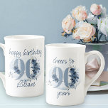 90th Birthday Cheers to 90 Years Floral Number Bone China Mug<br><div class="desc">90th birthday mug, with fully editable wording to personalise as you wish, such as "happy birthday [name]" and/or "cheers to 90 years". Design features number 90 decorated with rose buds, flower blooms and foliage in shades of coastal blue and sand. Subtle feminine and elegant design with watercolor floral arrangements, paint...</div>