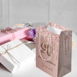 90th birthday rose gold blush glitter drips name medium gift bag<br><div class="desc">Elegant, classic, glamourous and girly for a 90th birthday party. Rose gold and blush pink, gradient background. Decorated with rose gold, pink faux glitter drips, paint dripping look. Personalise and add a name. With the text: Happy Birthday. The name is written with a modern dark rose coloured hand lettered style...</div>