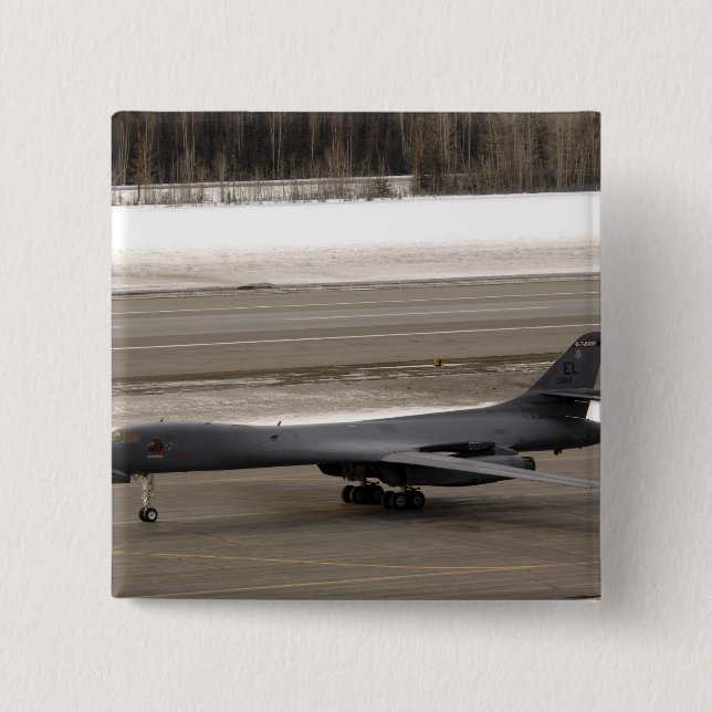 A B-1B Lancer performs a touch and go 15 Cm Square Badge (Front)