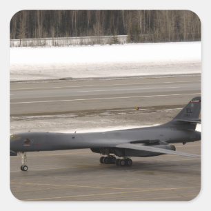 A B-1B Lancer performs a touch and go Square Sticker