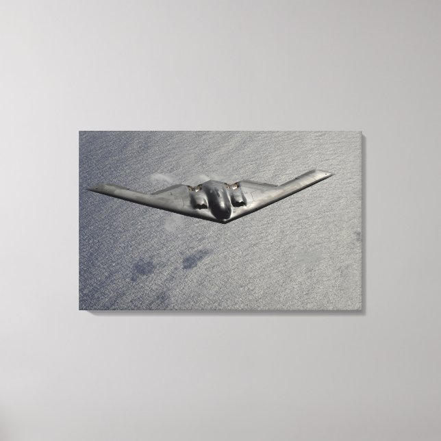 A B-2 Spirit flies over the Pacific Ocean Canvas Print (Front)