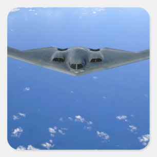 A B-2 Spirit soars through the sky Square Sticker