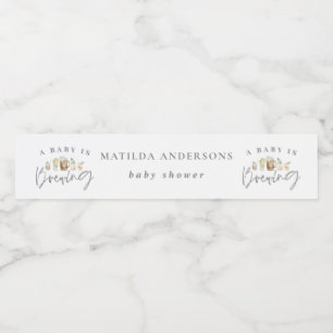 A baby is brewing watercolour beer baby shower water bottle label