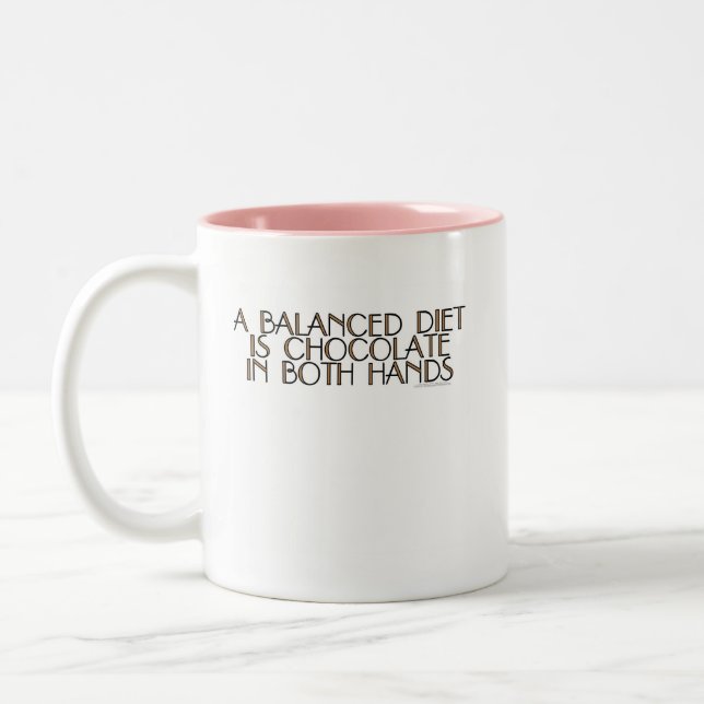 A balanced diet is chocolate in both hands Two-Tone coffee mug (Left)
