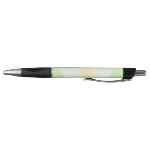 A ballpoint pen with a soft green and yellow