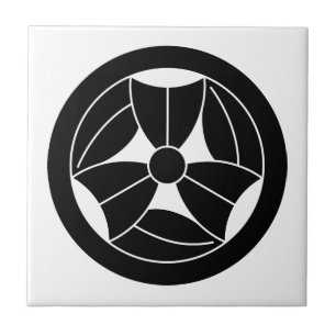 a bamboo leaf that is broken three times in a circ tile
