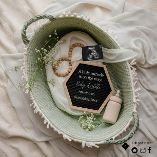 A beautiful lush green basket pregnancy announceme invitation