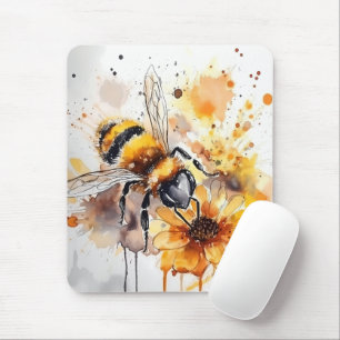A bee collects honey on a flower. mouse mat