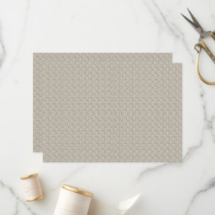 a beige background with a pattern of small squares programme