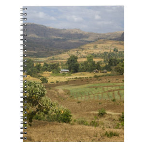 A big scenic view of a big rock mountain notebook