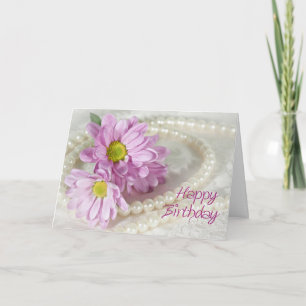 A birthday card with daisies