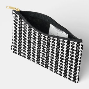 a black and white background with a lot of dots accessory pouch