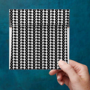 a black and white background with a lot of dots envelope
