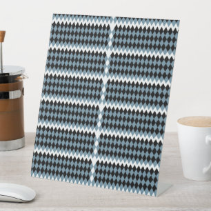 a black and white chequered pattern with a white b pedestal sign